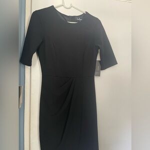 Black fully lined dress tags still on. Never worn